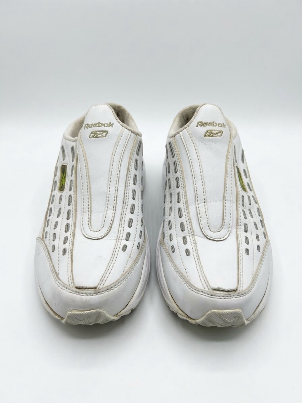 Reebok  Women’s White Athletic Slip-On Shoes with Gold Logo